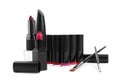 Different beautiful lipsticks and makeup brushes on white background