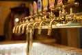 Different beer taps in a row Royalty Free Stock Photo