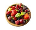 Different berries and fruits in a bowl. Mixed berries isolated in wooden bowl on white.