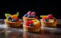 Different berry tarts on light table. Delicious pastries. Royalty Free Stock Photo