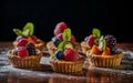 Different berry tarts on light table. Delicious pastries. Royalty Free Stock Photo