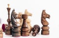 Different black and white wooden chess pieces, horse in the foreground, leadership background Royalty Free Stock Photo