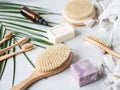 Different body brushes, pumice, bamboo toothbrush, white towel and a piece of soap on a grey background. Zero waste concept Royalty Free Stock Photo