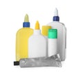Different bottles, tube and sticks of glue on white background