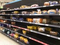 Bread shelves in a supermarket are half empty