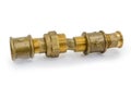 Different brass threaded plumbing components connected together