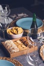 Different bread toast slices on a wooden box on a prepared and served food table on a restaurant Royalty Free Stock Photo