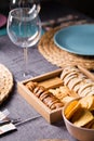 Different bread toast slices on a wooden box on a prepared and served food table on a restaurant Royalty Free Stock Photo