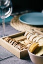 Different bread toast slices on a wooden box on a prepared and served food table on a restaurant Royalty Free Stock Photo