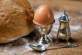 different bread on the wooden table, flour, egg, silver utensil, vintage