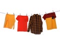 Different bright clothes drying on washing line against background Royalty Free Stock Photo