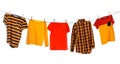 Different bright clothes drying on washing line against white background Royalty Free Stock Photo