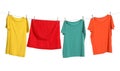 Different bright clothes drying on washing line against white background Royalty Free Stock Photo