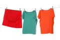 Different bright clothes drying on washing line against background Royalty Free Stock Photo