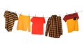 Different bright clothes drying on washing line against background Royalty Free Stock Photo