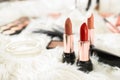 Different bright lipsticks on dressing table Royalty Free Stock Photo