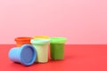 Different bright play dough on color background. Space for text