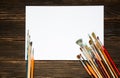 Different brushes to paint with white sheet for records on dark Royalty Free Stock Photo