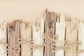 Different bundles of raw asian noodles close up on beige wooden board background, top view.