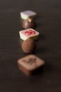 Different candies on a wooden table.