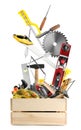 Different carpenter`s tools falling into wooden box on white background Royalty Free Stock Photo