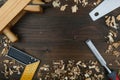 Carpentry tools on dark wood background