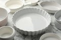 Different casseroles on white marble table, closeup Royalty Free Stock Photo