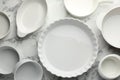 Different casseroles on white marble table, flat lay Royalty Free Stock Photo