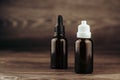 different cbd oil or organic cosmetics brown glass bottle