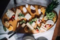 photo of different cheese kinds on a wooden plate