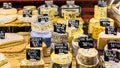 Different cheeses on the counter of a small store at the Aligre