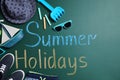 Different child accessories and text Summer Holidays on green chalkboard. School`s Out Royalty Free Stock Photo