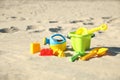 Different child plastic toys on beach