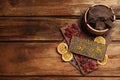 Different chocolate bars with freeze dried fruits on wooden table, flat lay. Space for text Royalty Free Stock Photo