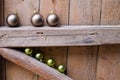 Different Christmas balls on old wooden background wall. Royalty Free Stock Photo
