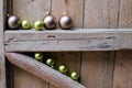 different Christmas balls on old wooden background wall. Royalty Free Stock Photo