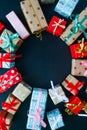 Different christmas gifts on a black background Royalty Free Stock Photo