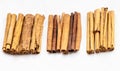 Different cinnamon sticks on white plate Royalty Free Stock Photo
