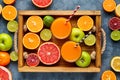 Different citrus fruit on a wooden box and grey concrete table. Fruit food background. Healthy eating. Antioxidant Royalty Free Stock Photo