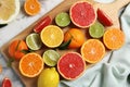 Different citrus fruits on marble background
