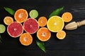 Different citrus fruits on wooden background Royalty Free Stock Photo