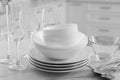 Different clean dishware, cutlery and glasses on white marble table in kitchen, closeup Royalty Free Stock Photo