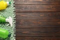 Different cleaning products and supplies on wooden table, flat lay. Space for text Royalty Free Stock Photo