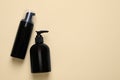 Different cleansers on beige background, flat lay with space for text. Cosmetic product