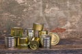 Different closed canned food on old wooden background Royalty Free Stock Photo