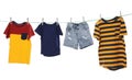 Different clothes drying on washing line against white background Royalty Free Stock Photo