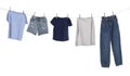 Different clothes drying on washing line against white background Royalty Free Stock Photo