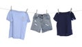 Different clothes drying on washing line against background Royalty Free Stock Photo