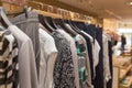 Different clothes on hangers close up in store Royalty Free Stock Photo