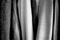 Different clothes placed in the wardrobe. Black and white. Good texture Royalty Free Stock Photo